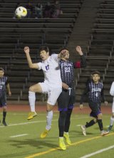 Lemoore's Diego Nunez with a header in Tuesday's semi-final matchup with Madera South. Madera beat the Tigers to earn a shot at the Division 3 title game. Lemoore's boys' basketball team fell in their semi-final matchup in San Luis Obispo.